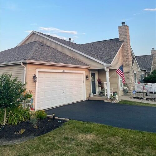 home with an asphalt shingle roof