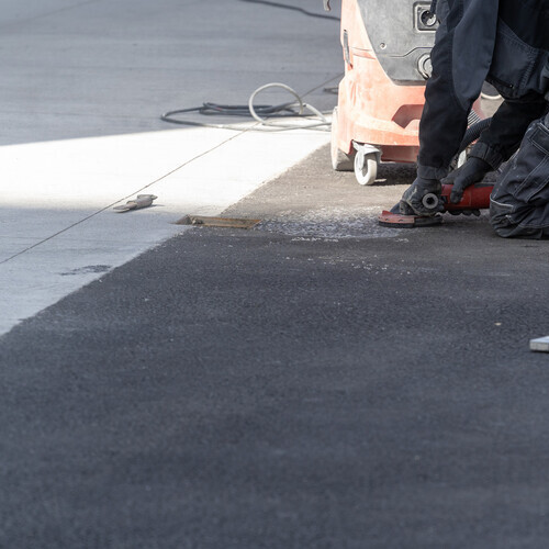 workers repairing a commercial roof