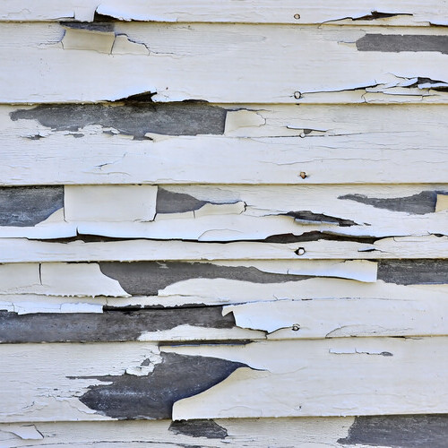 closeup of damaged siding