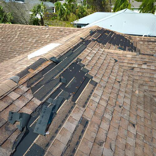 a roof with missing shingles